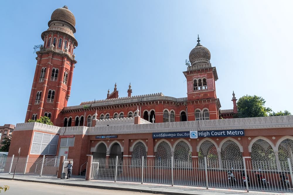 The court is an imposing red Indo-Saracenic structure 